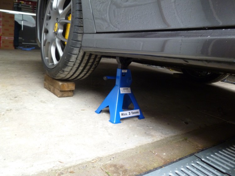 Axle stand at front of car