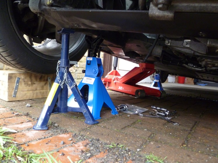 Axle stands at rear of car